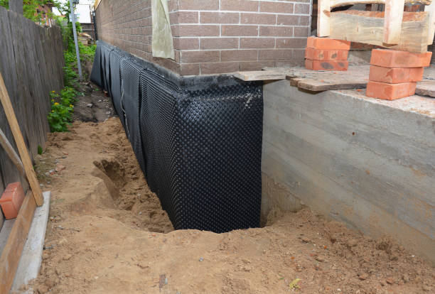 Happy homeowners after waterproofing job in Portland